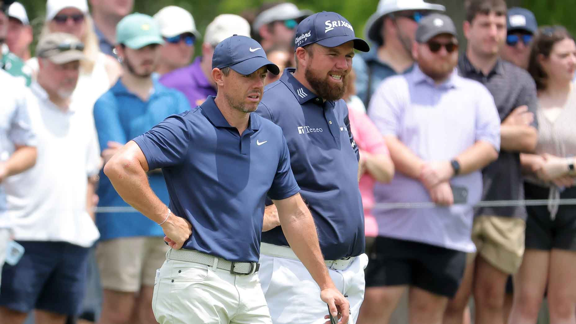 Rory McIlroy of Northern Ireland and Shane Lowry of Ireland react on the fourth green during the third round of the Zurich Classic of New Orleans at TPC Louisiana on April 27, 2024 in Avondale, Louisiana.
