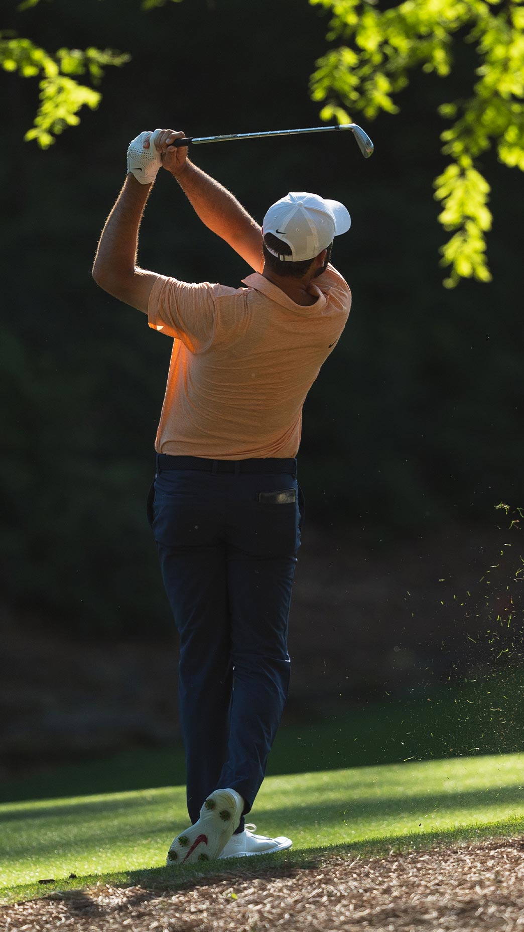 Scottie Scheffler hits approach at Amen Corner.