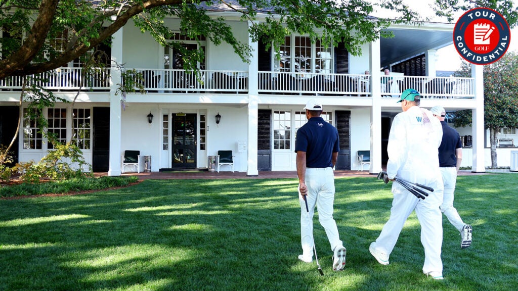 Tiger Woods leaves the course to enter the Clubhouse after practicing a few holes with Rob McNamara and caddie Lance Bennett prior to the 2024 Masters Tournament