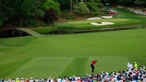 tiger woods tees off on the 12th hole during the final round of the 2019 masters