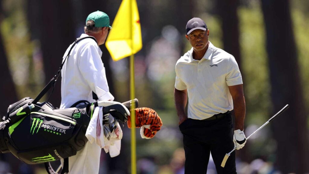Tiger Woods and caddie stand on green Saturday at 2024 Masters
