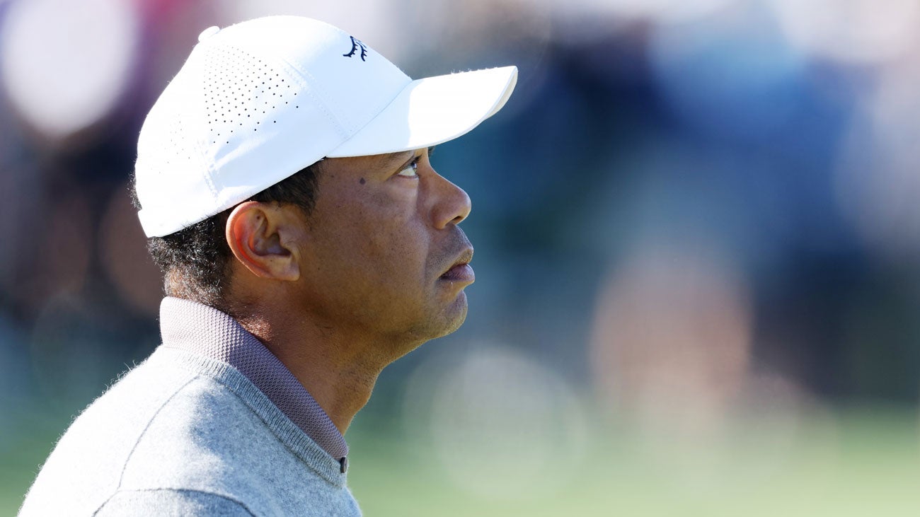 Tiger Woods of the United States reacts on the 18th green during the continuation of the first round of the 2024 Masters Tournament at Augusta National