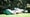 A pro golfer's golf bag is pictured on the ground at the 2024 Masters