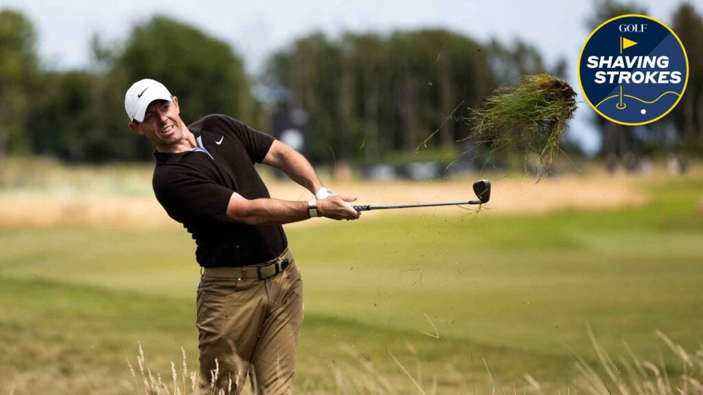 Golfer hits wedge shot on golf course