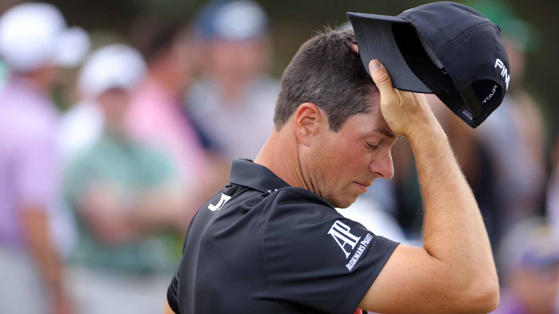 viktor hovland runs his hand through his hair at the 2024 masters