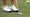 close-up of jordan spieth's wedge and golf ball next to his feet