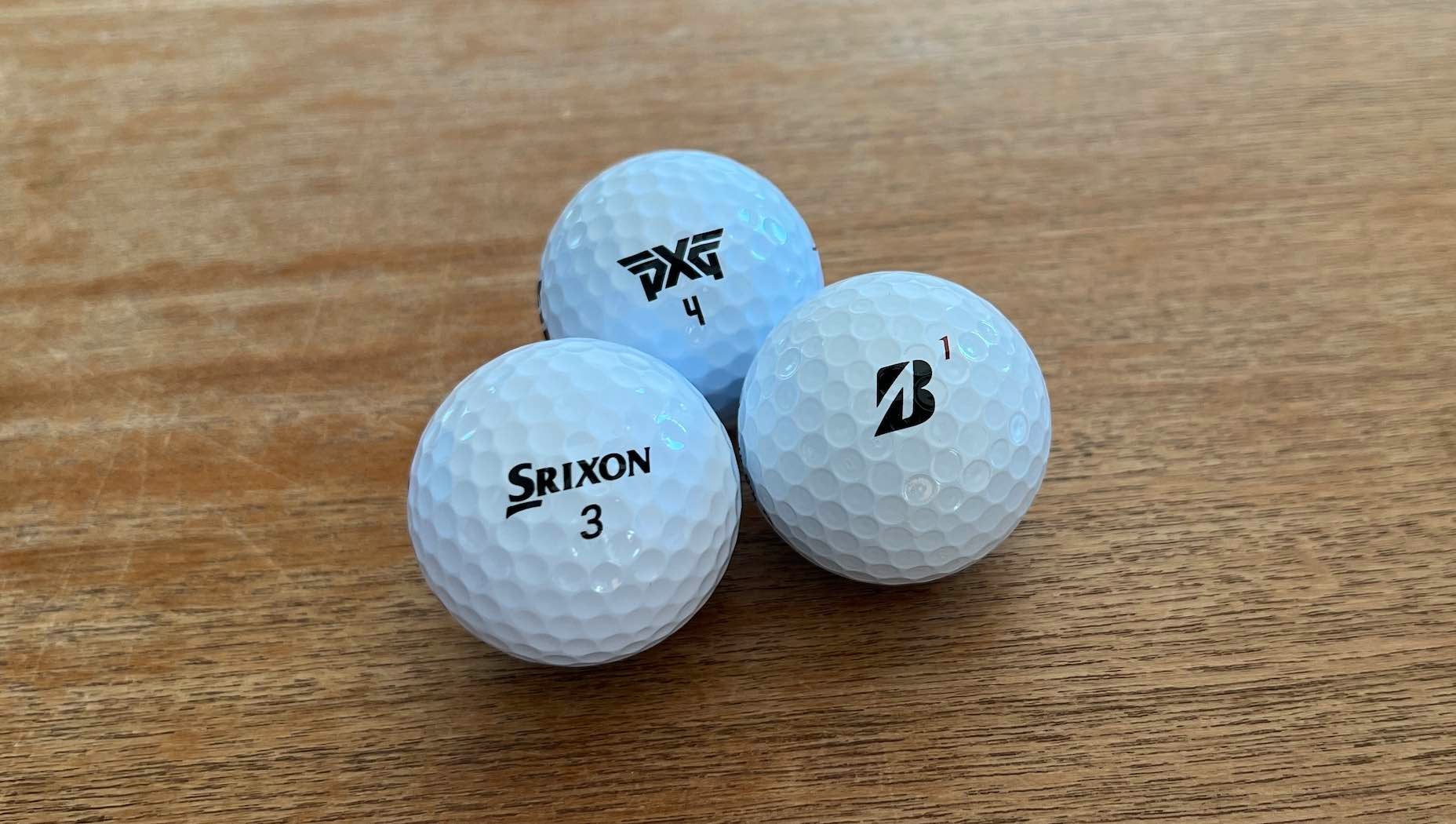 Golf balls under 40 dollars arranged on a desk