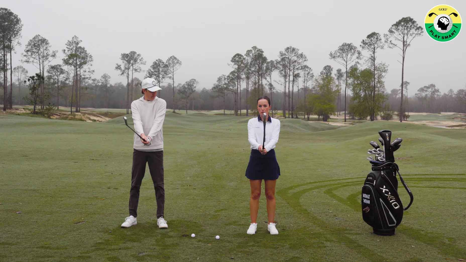 GOLF editor zephyr melton stands next to nathalie sheehan as she explains how to cure the shanks