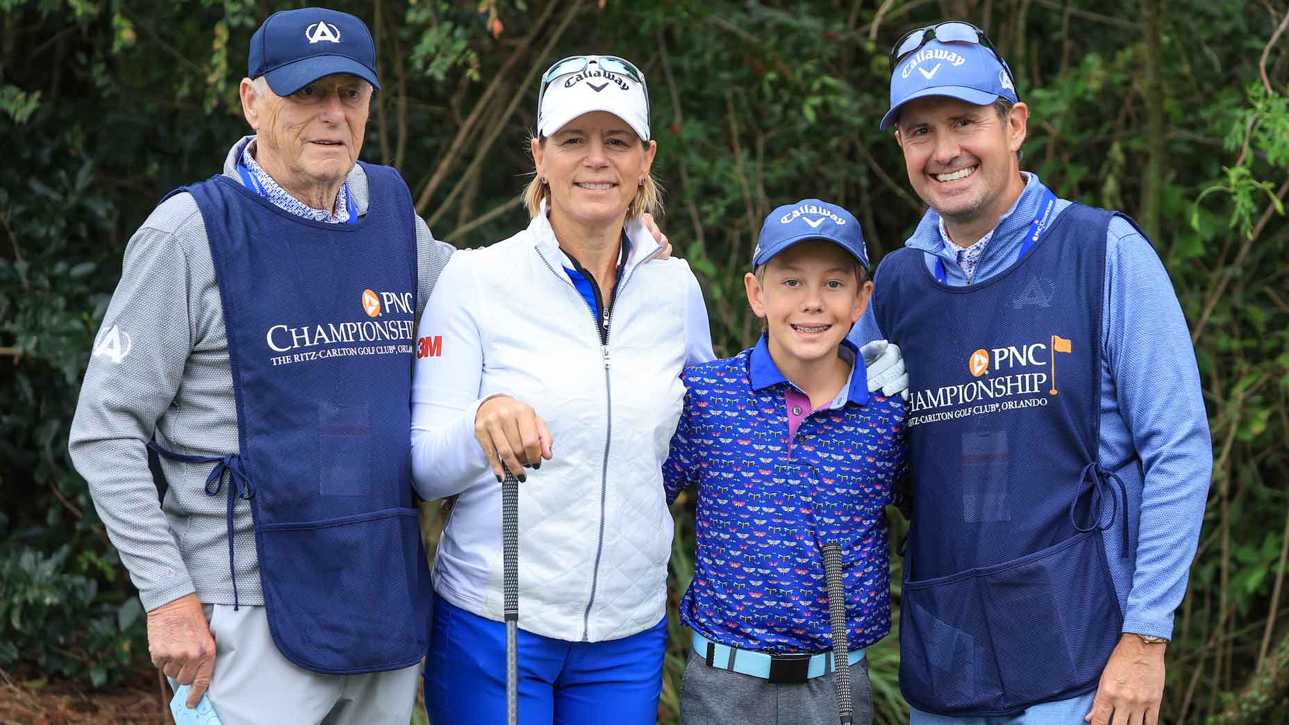 Annika Sorenstam of Sweden poses for a photograph with her son Will McGee, her grandfather Tom Sorenstam and her husband Mike McGee on the first tee during the final round of the PNC Championship at The Ritz-Carlton Golf Club on December 17, 2023 in Orlando, Florida.