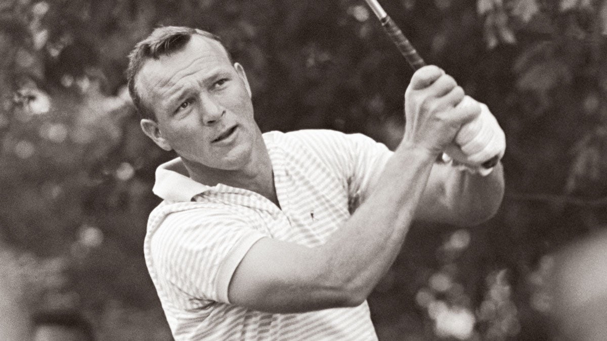 Arnie, with his overlapping grip and slight right-hand index trigger finger, drives at the U.S. Open.