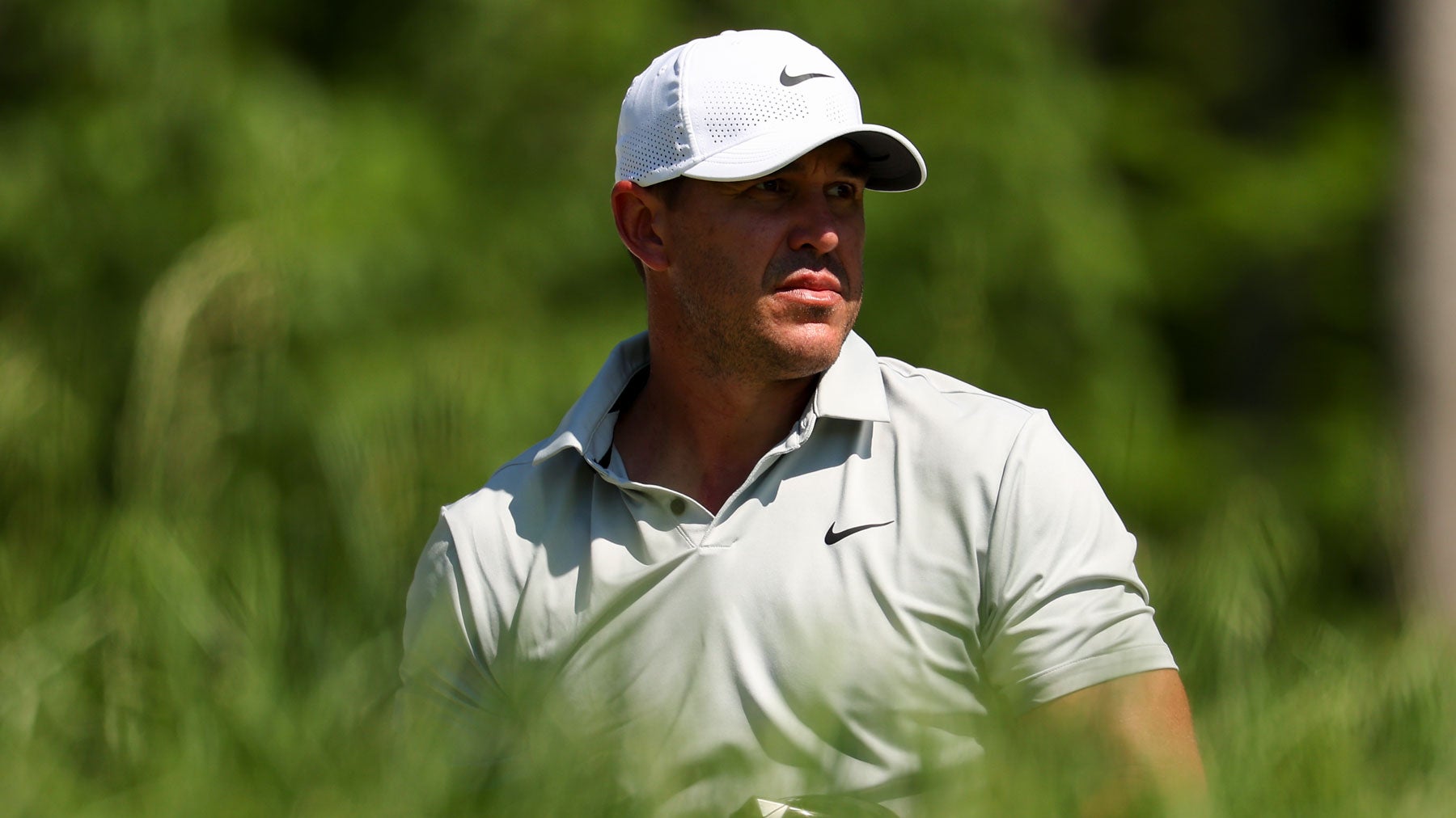 Brooks Koepka watches his tee shot on the fourth hole on the fourth hole during the final round of the PGA Championship at Valhalla Golf Club