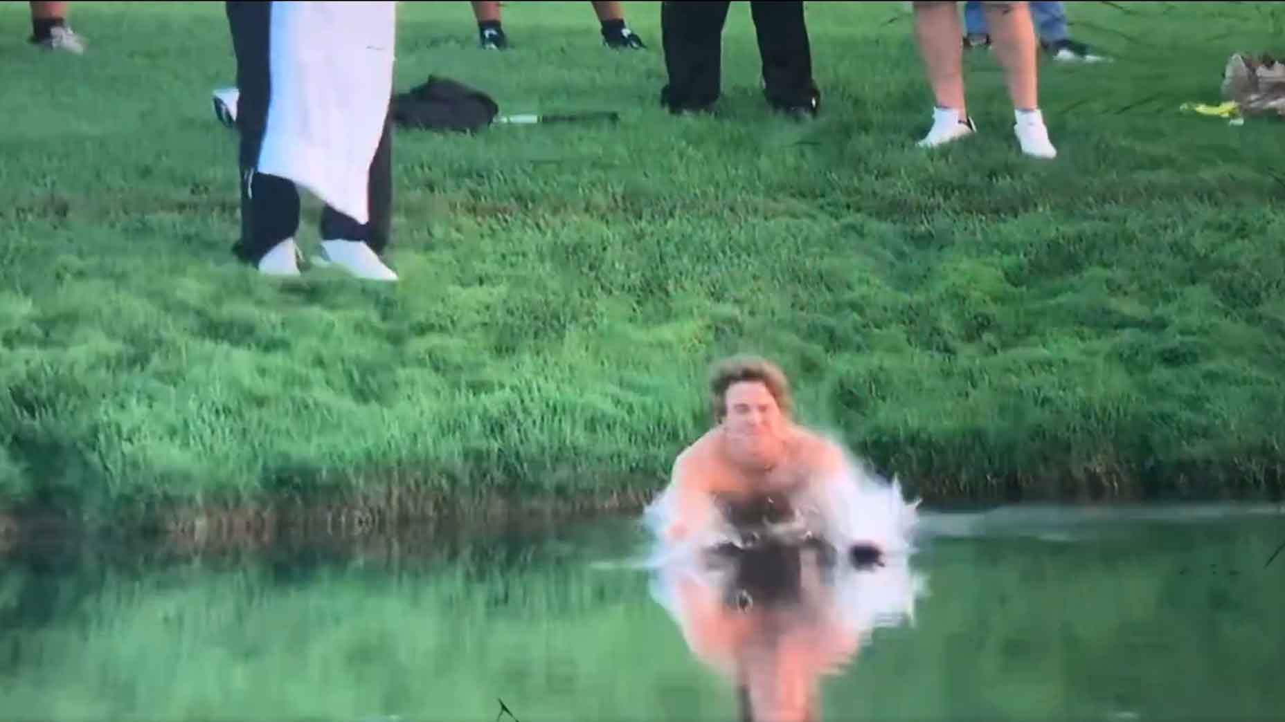 Spectator enters water to retrieve a club for Adam Hadwin at 2024 PGA Championship