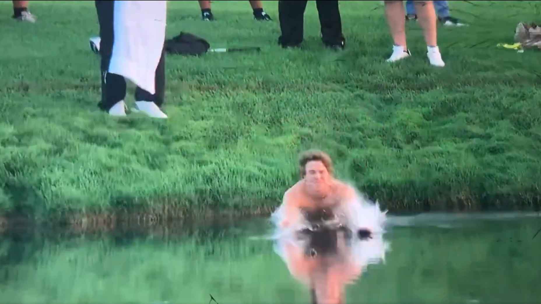 Spectator enters water to retrieve a club for Adam Hadwin at 2024 PGA Championship