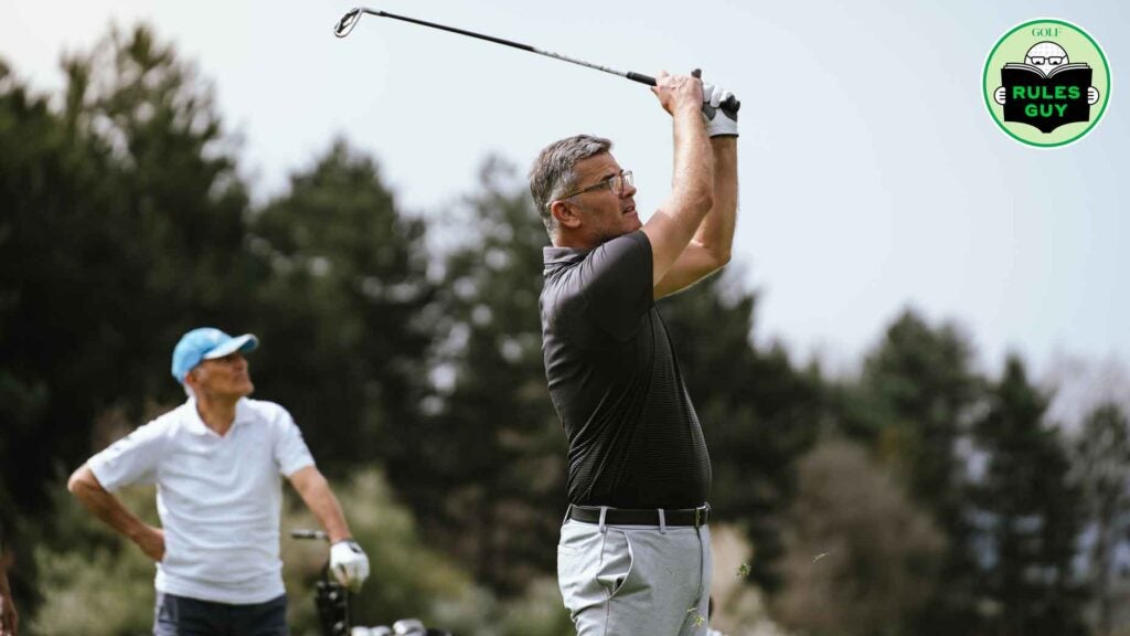 Golfer hitting his tee shot on golf course