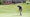 graeme mcdowell hits a putt on the green