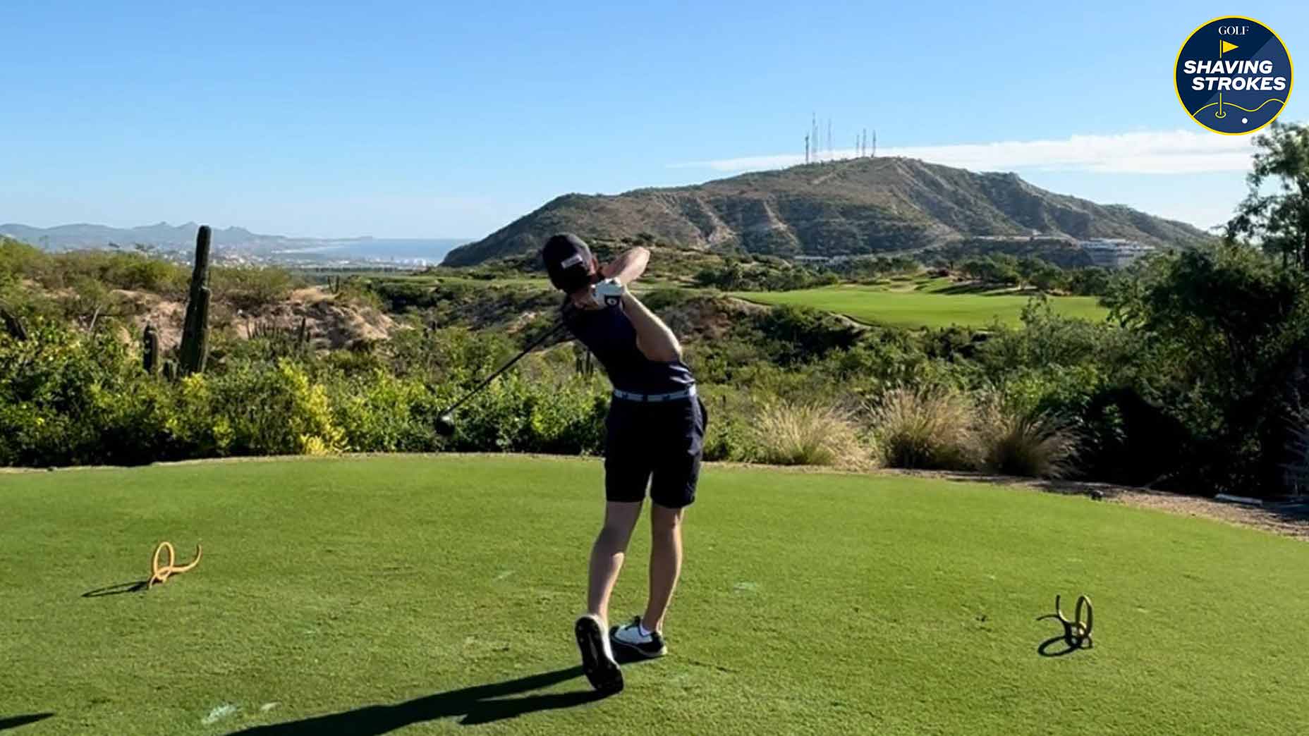 High School golfer hits drive on golf course