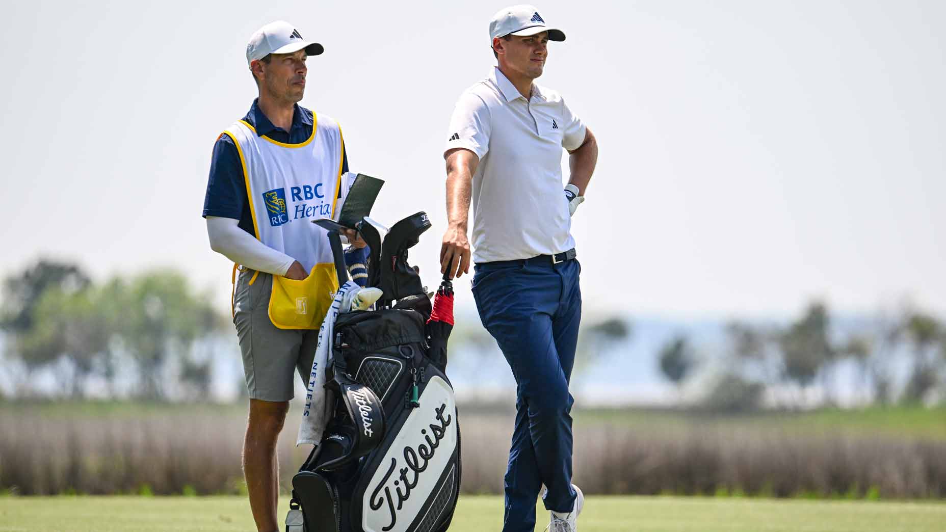 ludvig aberg stands with his caddie joe skovron during the 2024 rbc heritage