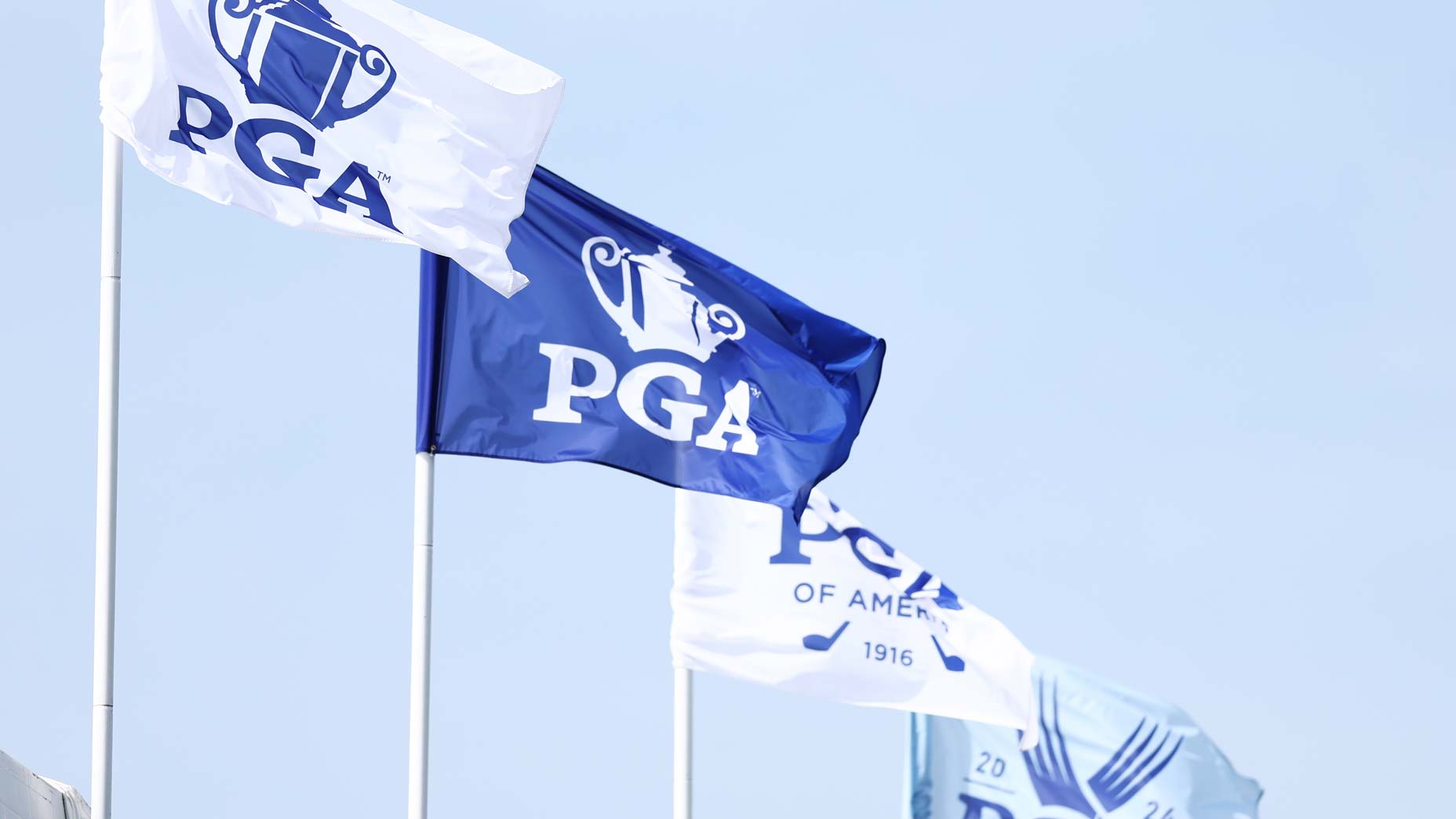 The 2024 PGA Championship flags are blowing in the wind at Valhalla