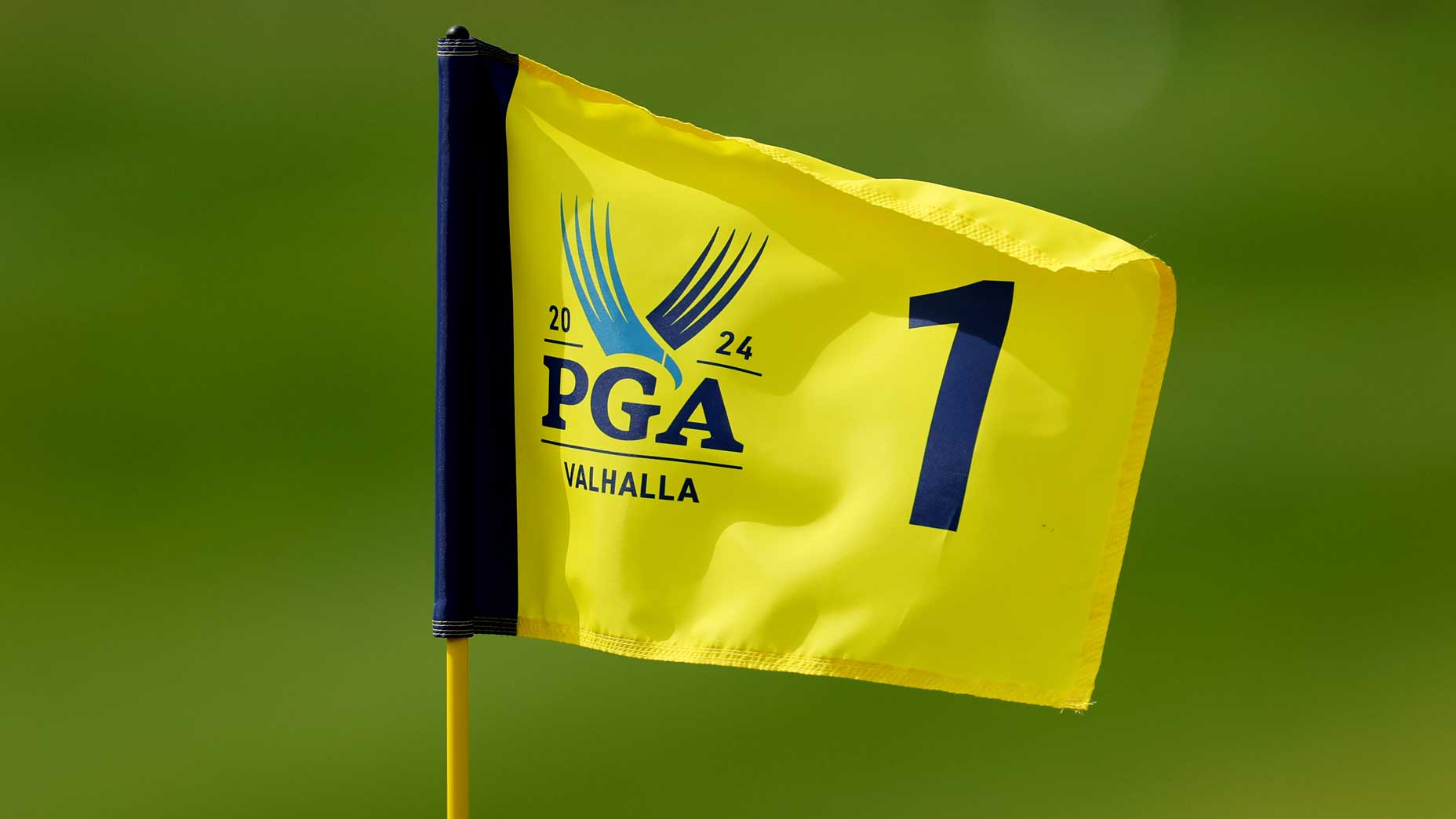 A close-up image of a yellow 2024 PGA Championship flag at Valhalla