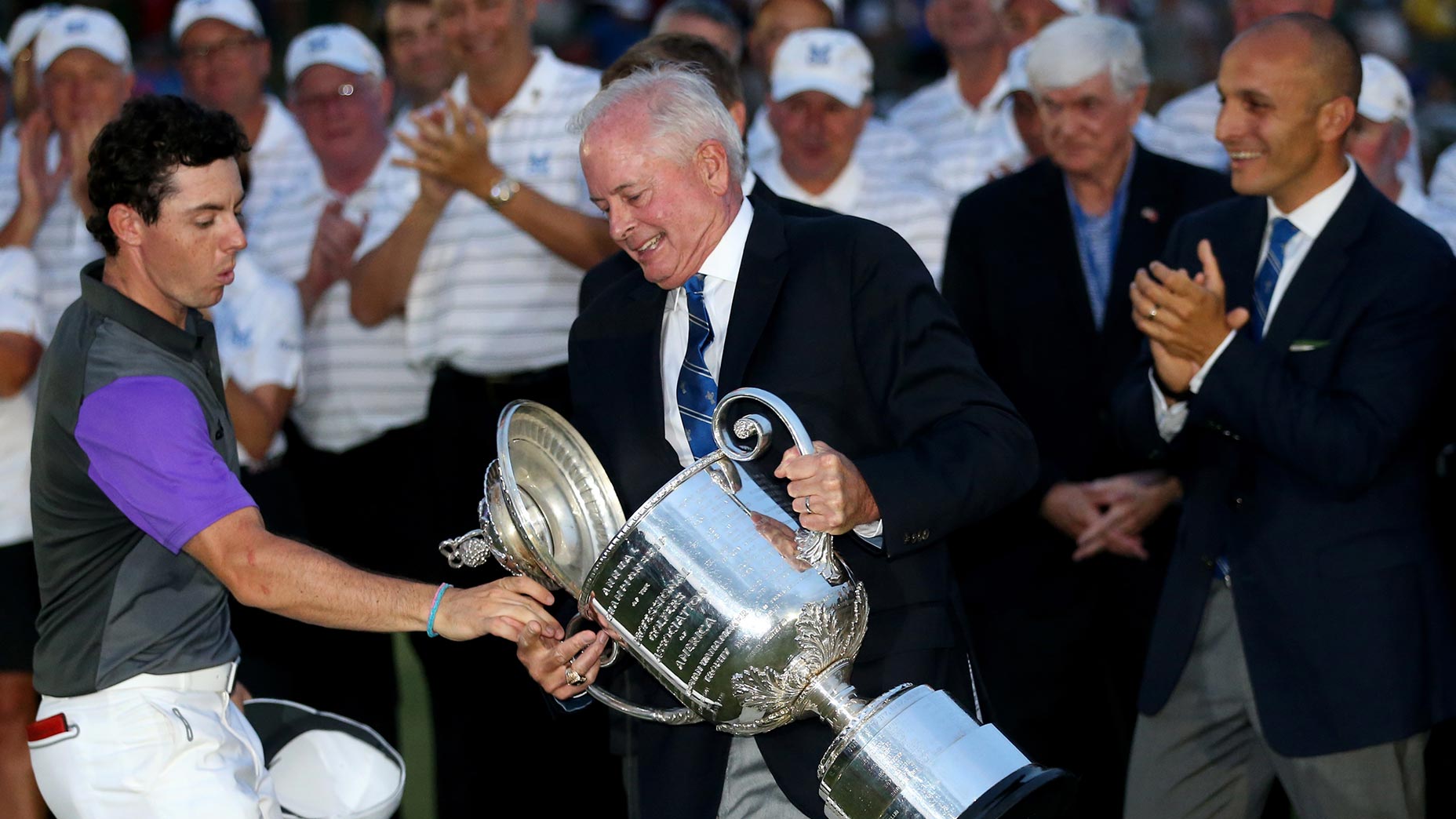 Pro golfer rory mcilroy drops wanamaker trophy at 2014 PGA championship.