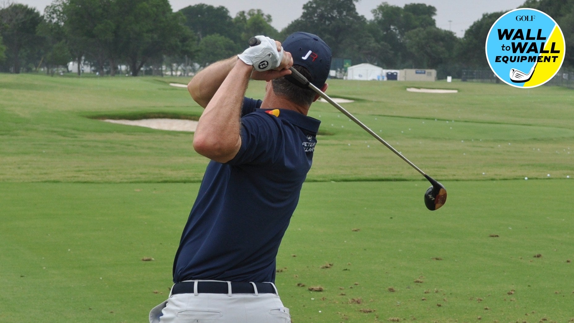 Pro golfer justin rose hits persimmon driver at PGA Tour event.