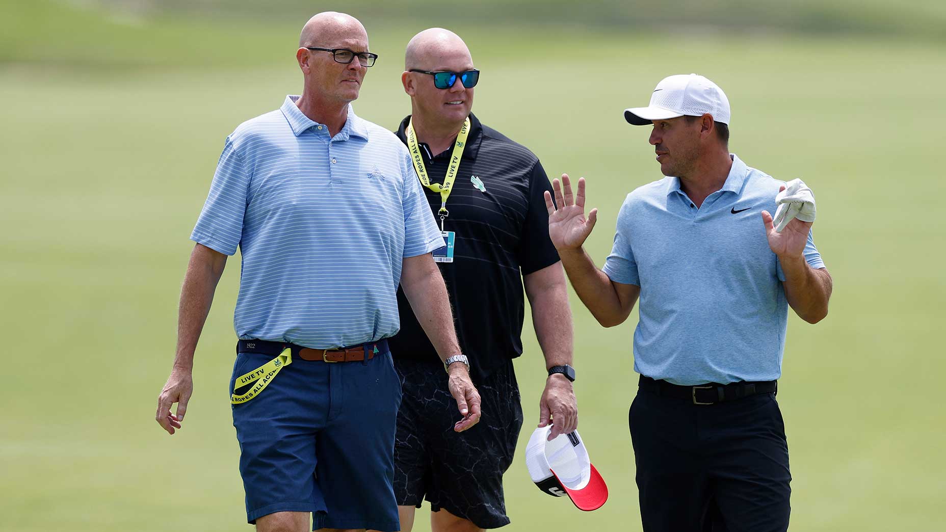 ESPN commentators Scott Van Pelt and Steve Coughlin talk to Brooks Koepka at the 2024 PGA Championship.