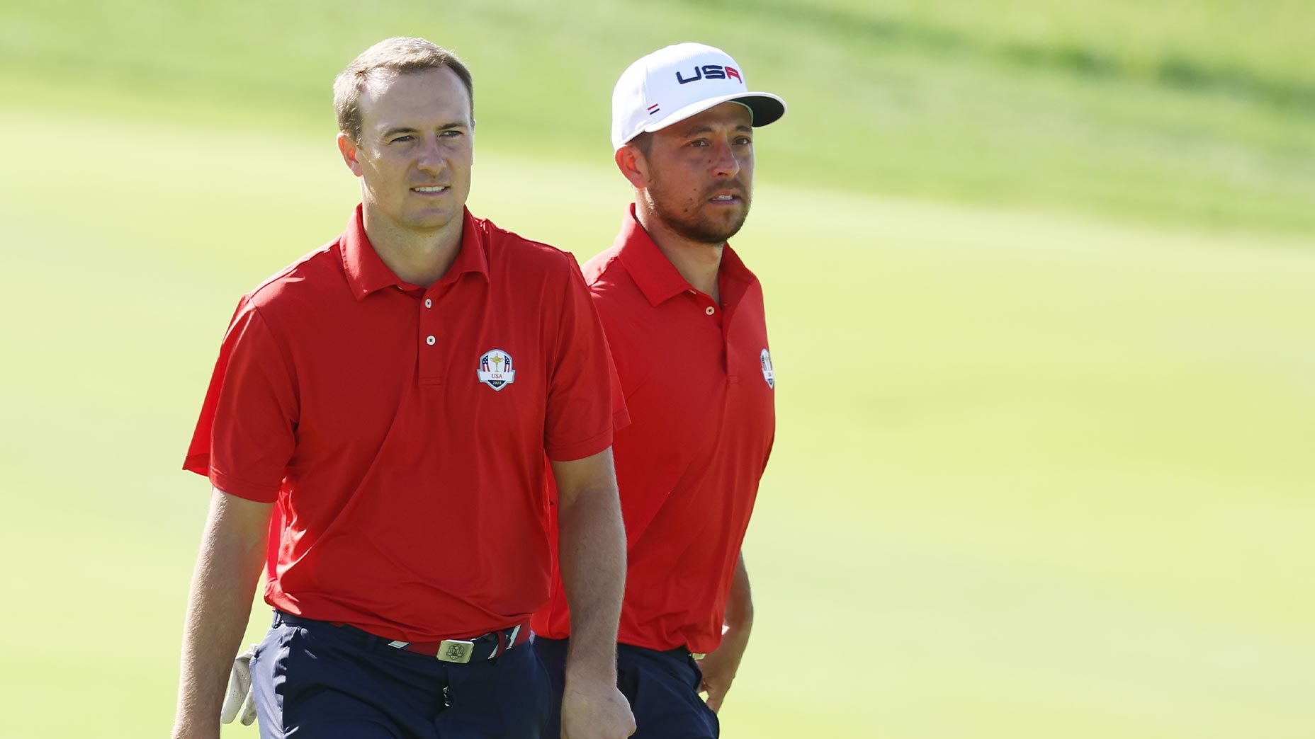 jordan spieth and xander schauffele stand next to one another at the Ryder Cup.