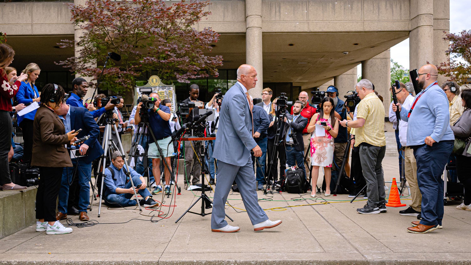 Steve Romines, legal representation for golfer Scottie Scheffler, walks away after an announcement by Jefferson County Attorney Mike O'Connel at Jefferson County Hall of Justice