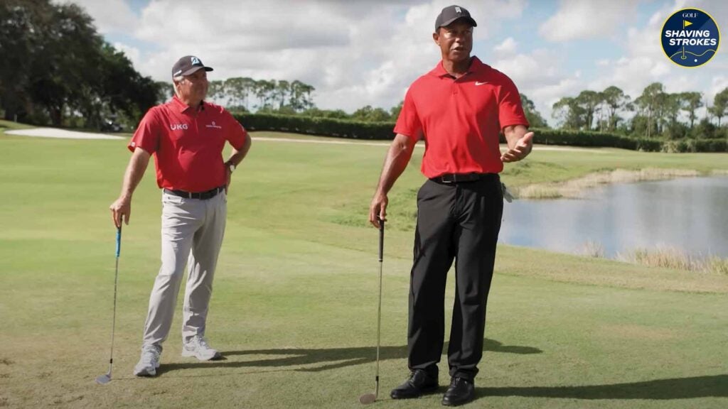 Tiger Woods shows Fred Couples how to hit his saucy draw chip