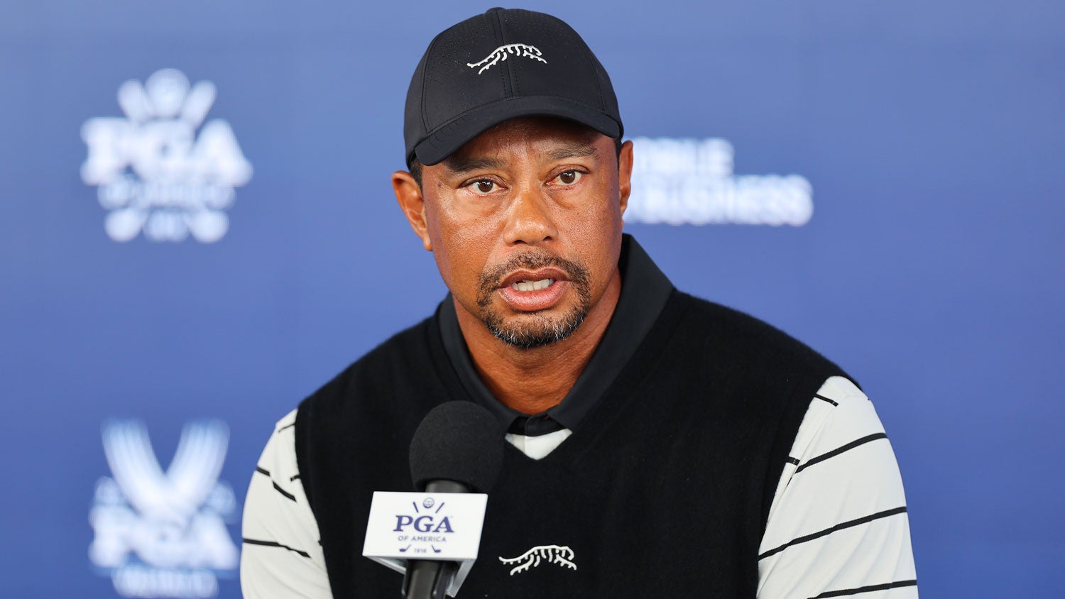 Tiger Woods of the United States speaks to the media during press conference during a practice round prior to the 2024 PGA Championship