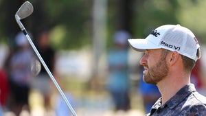 wyndham clark stares at wedge on practice range