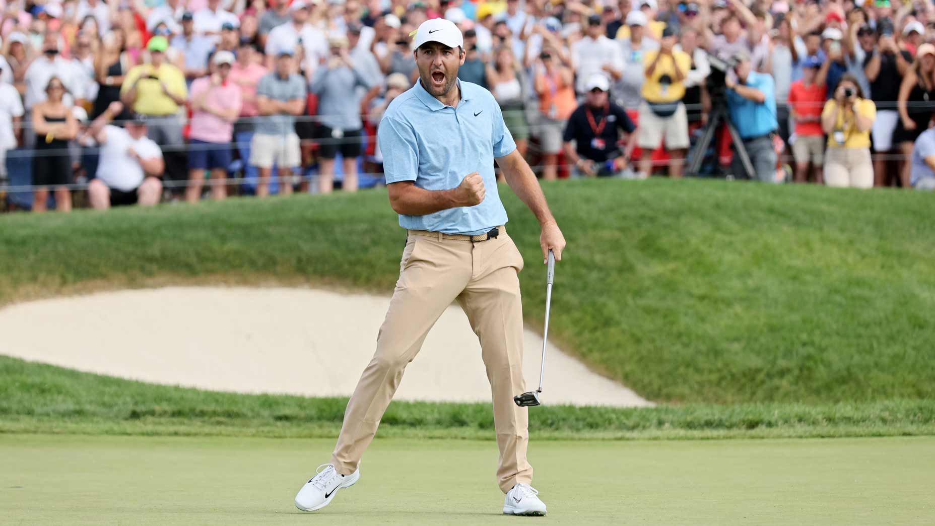 Scottie Scheffler pumps his fist after winning the Memorial.