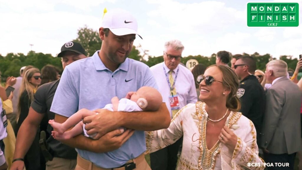 Scottie Scheffler, his wife Meredith and their son Bennett coming off No. 18 at Muirfield Village.