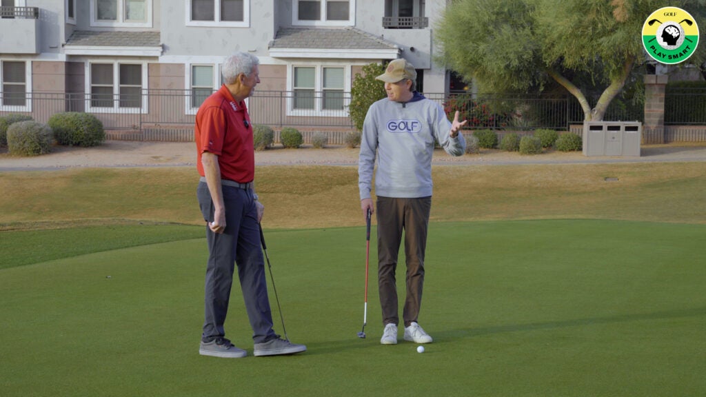 GOLF.com editor Zephyr Melton talks with Joe Hallett standing on a putting green