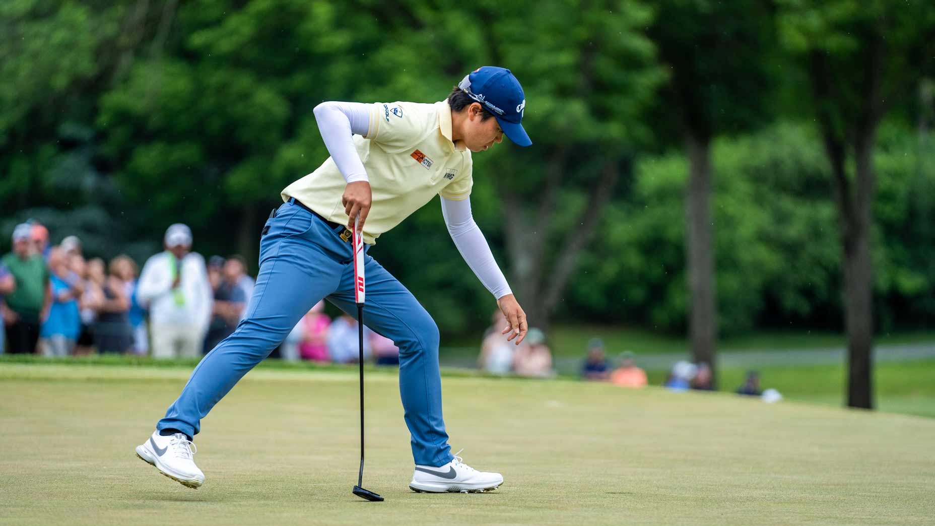 Yuka Saso walks in her putt at the U.S. Women's Open.