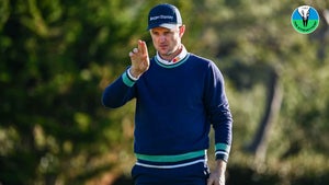 Justin Rose lines up a putt using the AimPoint method.