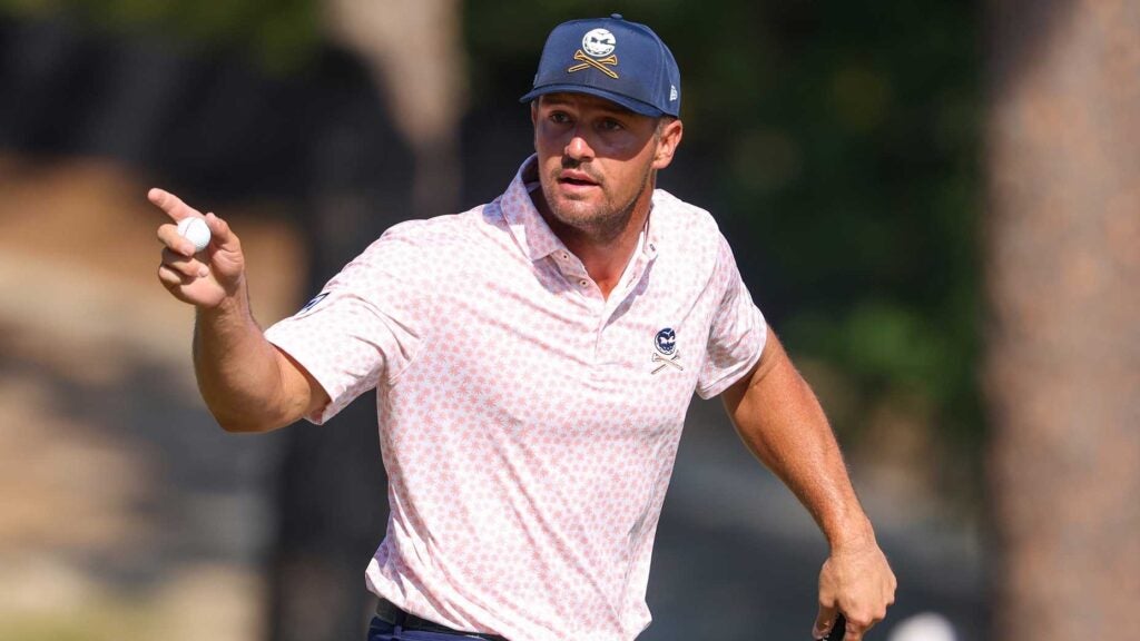 Bryson DeChambeau holds up "salty balls" golf ball at 2024 U.S. Open