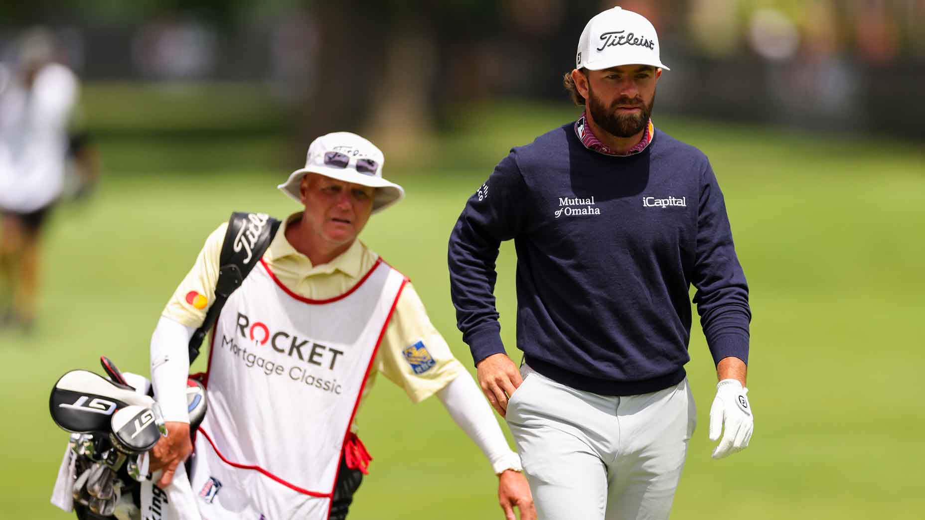 Cameron Young of the United States and caddie walk the eighth hole during the first round of the Rocket Mortgage Classic at Detroit Golf Club on June 27, 2024 in Detroit, Michigan.