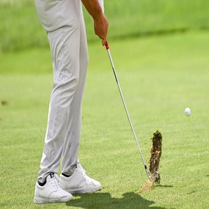 Jon Rahm of Spain makes a divot as he plays his second shot on the third hole fairway during the final round of THE NORTHERN TRUST,