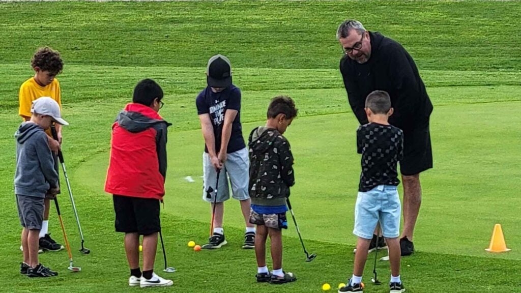 John Long works with kids in his First Tee program at Pine Ridge Reservation