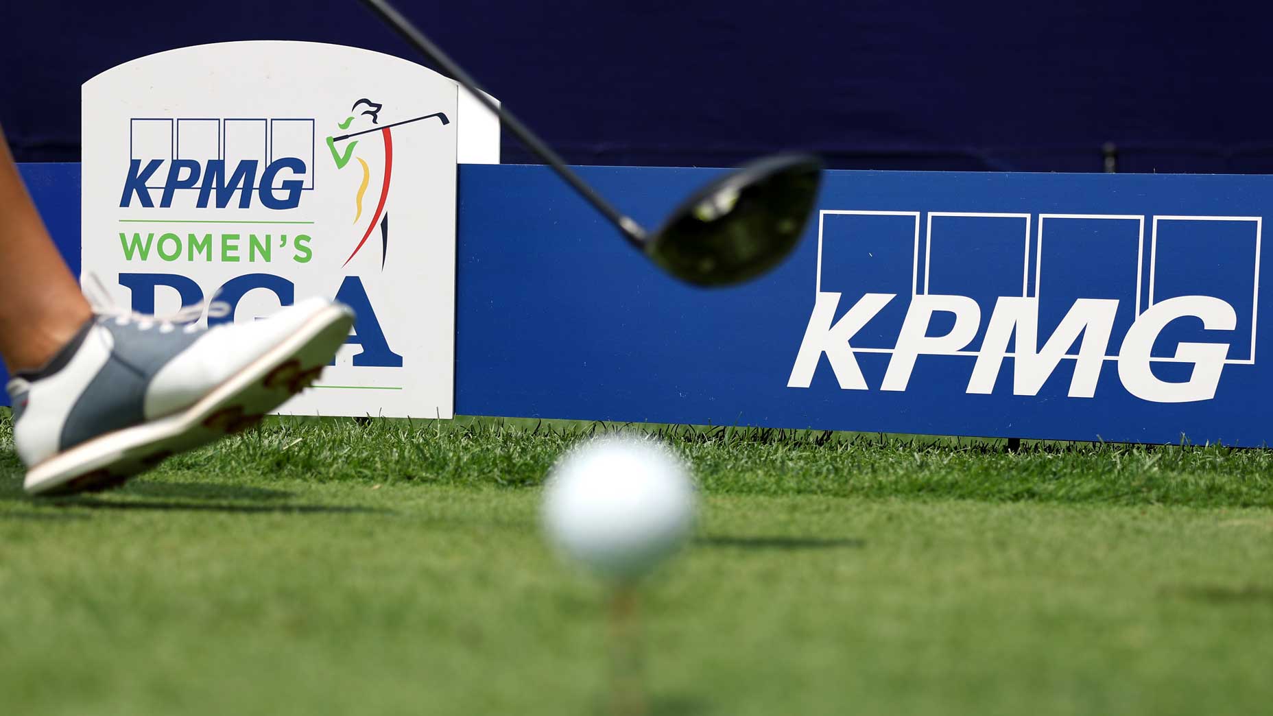 KPMG Women's PGA Championship sign next to golf ball on tee