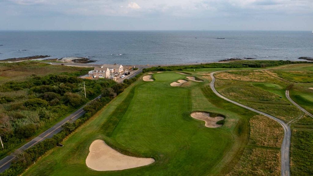 aerial view of newport country club with the atlantic ocean in the background