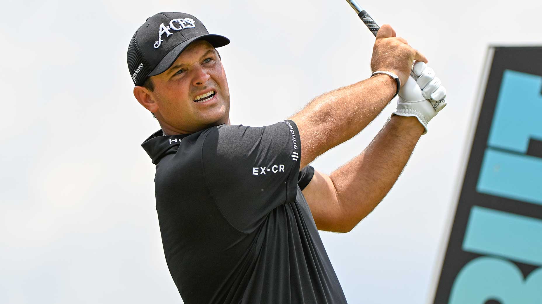 patrick reed watches a shot