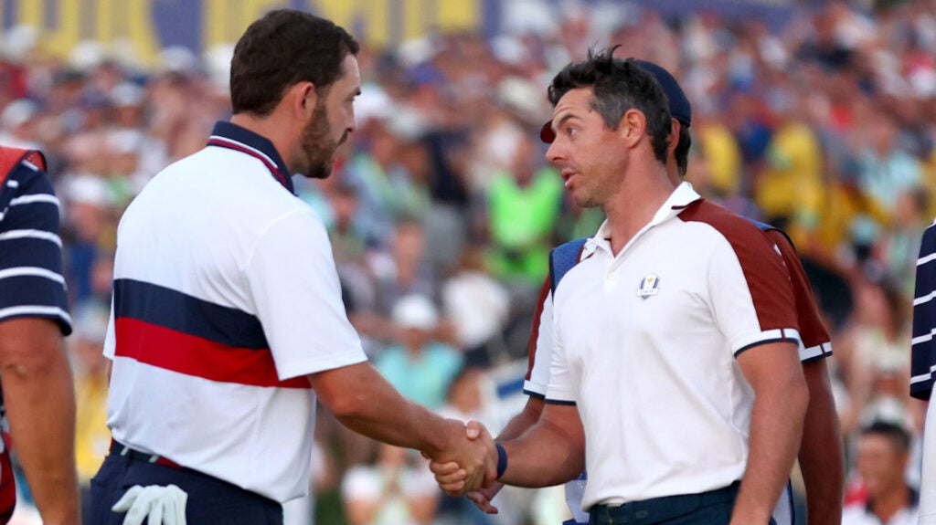 Patrick Cantlay of Team United States and Rory McIlroy of Team Europe shake hands on the 18th green during the Saturday afternoon fourball matches of the 2023 Ryder Cup