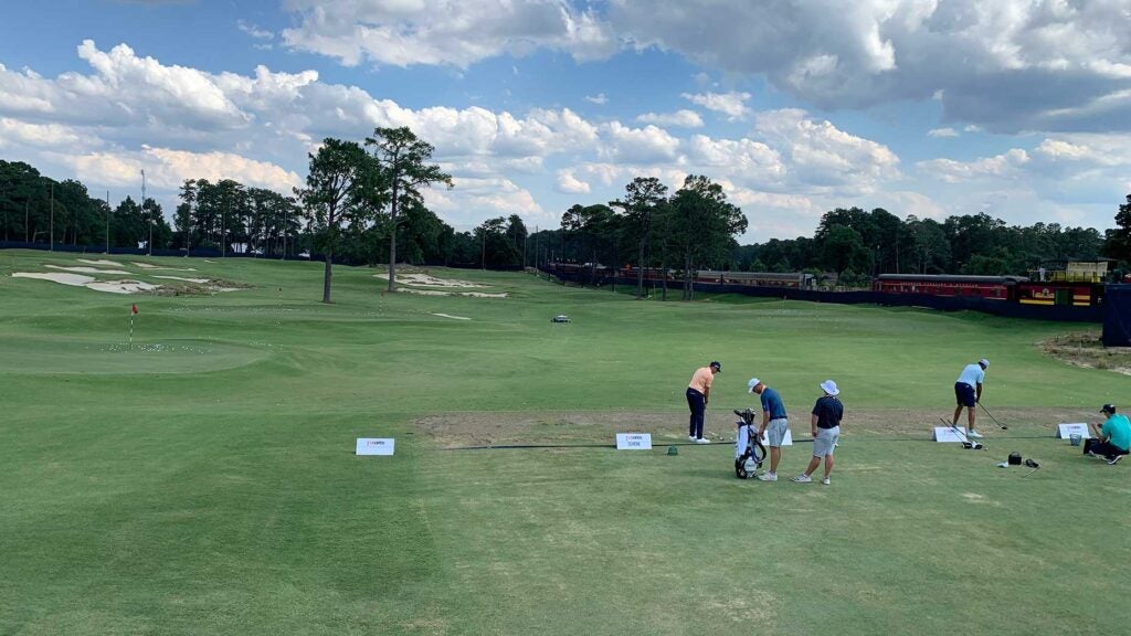 Pros warm up on the range (a.k.a. The Cradle) at Pinehurst Resort on Tuesday.