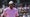 Tiger Woods stares at the U.S. Open in a pink shirt and white hat