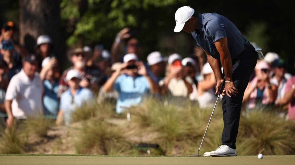 tiger woods puts his hands on his knees during the 2024 u.s. open