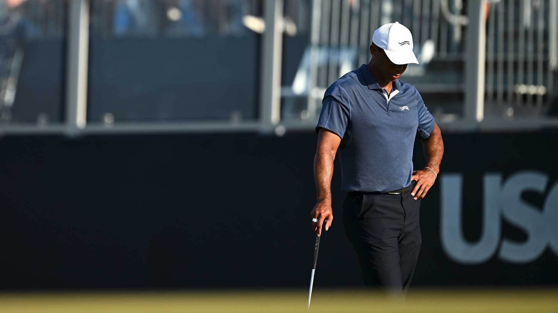 Tiger Woods looks down while standing on the green during the 2024 US Open.