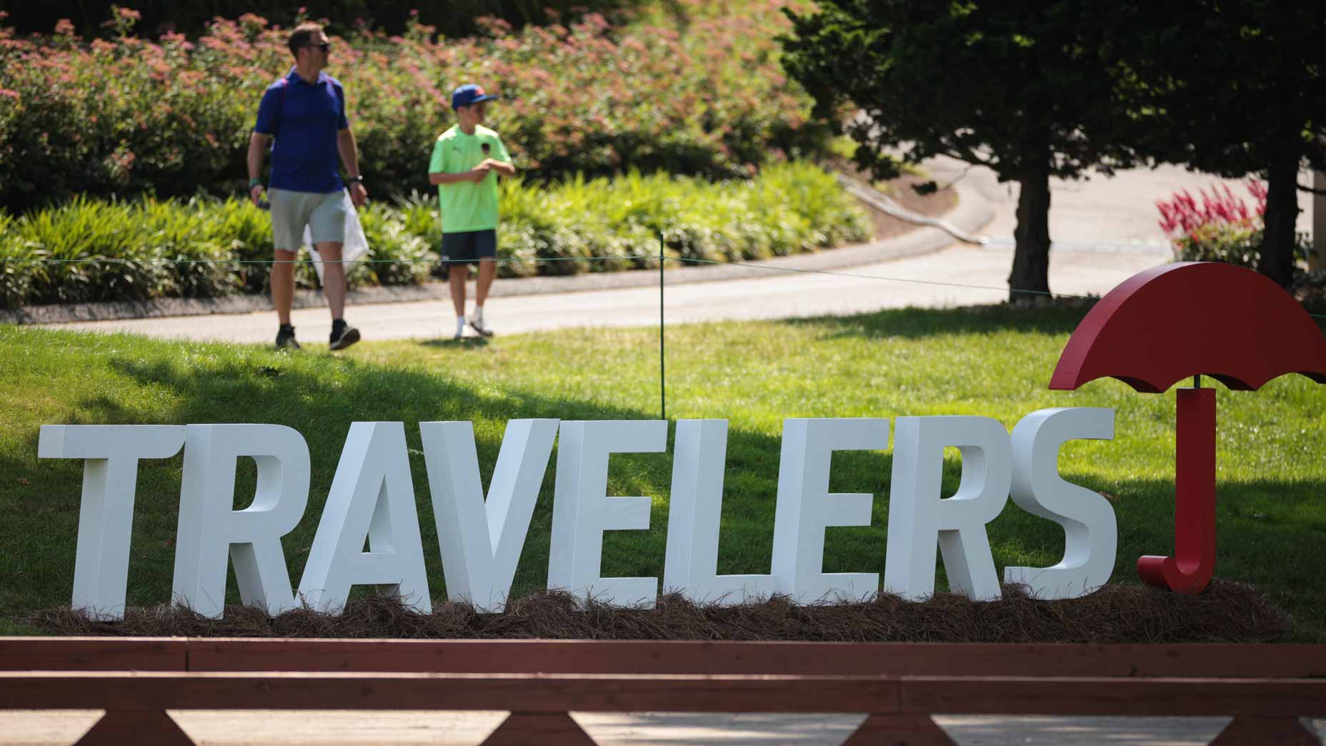A 2024 Travelers Championship sign is seen on the course
