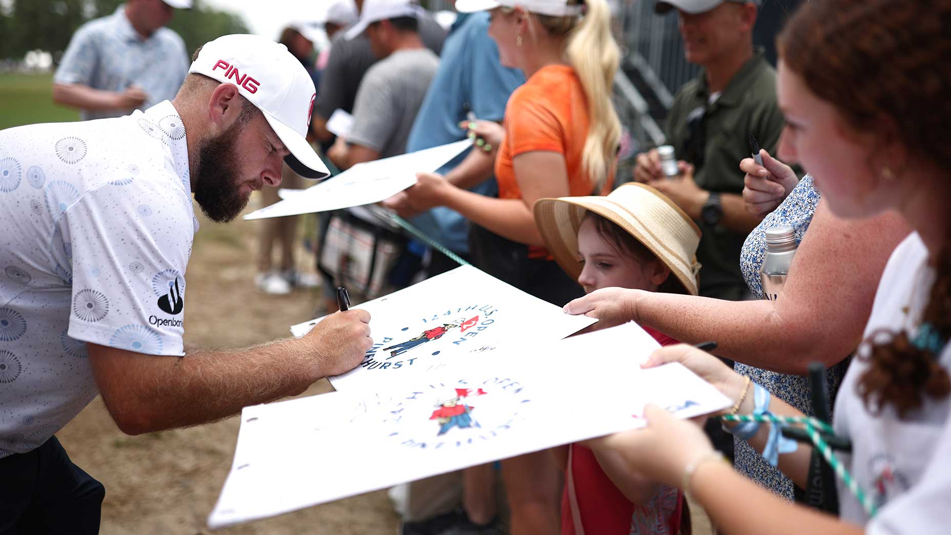 Tyrrell Hatton signs autographs on Wednesday at Pinehurst.